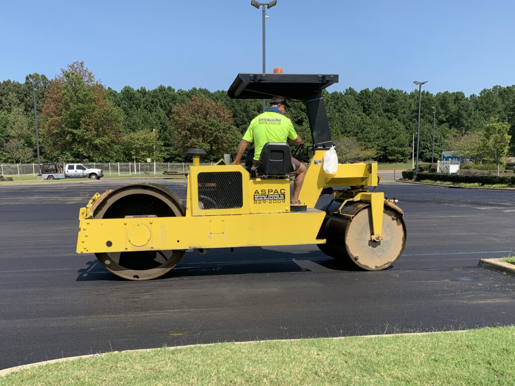 ASPAC Paving Co. Roller goes through parking lot